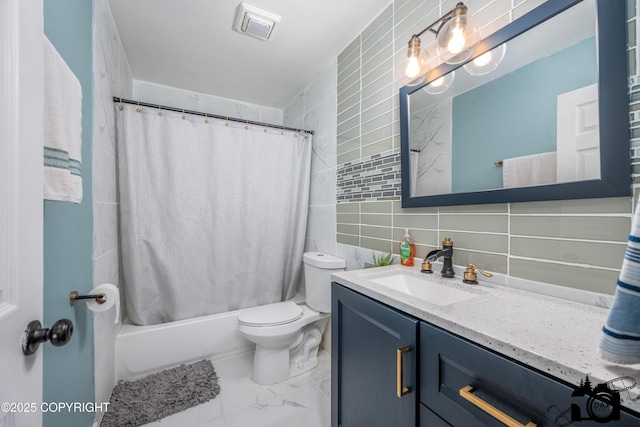 3501 N Calder Rd, Wasilla, AK 99654 - full bathroom with tile walls, tasteful backsplash, vanity, shower / tub combo, and marble look tiles
