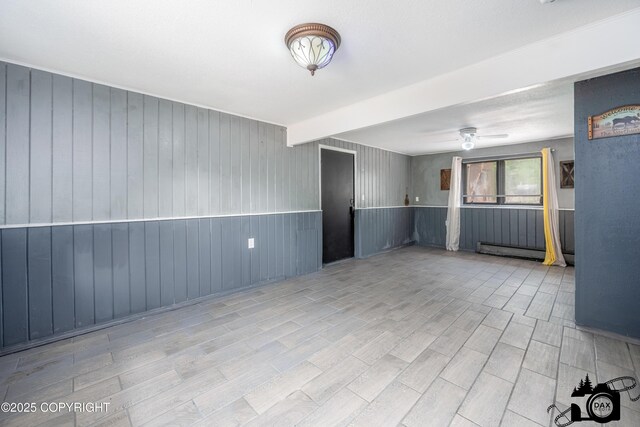 3501 N Calder Rd, Wasilla, AK 99654 - spare room with wood finished floors, ceiling fan, and beamed ceiling