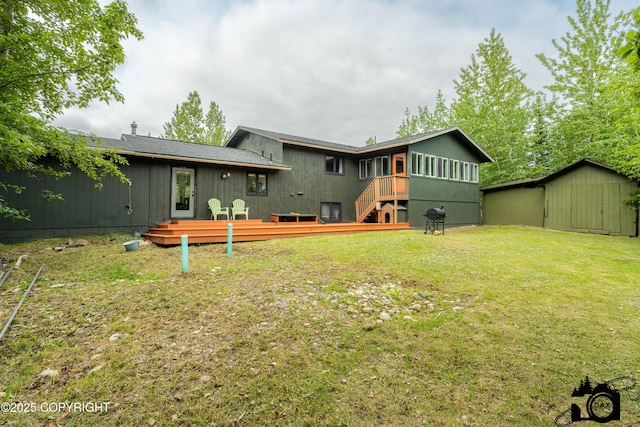 3501 N Calder Rd, Wasilla, AK 99654 - rear view of house with a storage unit, a deck, a yard, and stairs