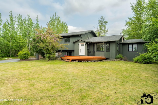 3501 N Calder Rd, Wasilla, AK 99654 - rear view of property with a deck and a lawn