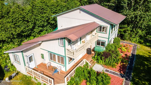 12230 Nautical Ave, Seward, AK 99664 - view of property exterior with a wooden deck and a metal roof