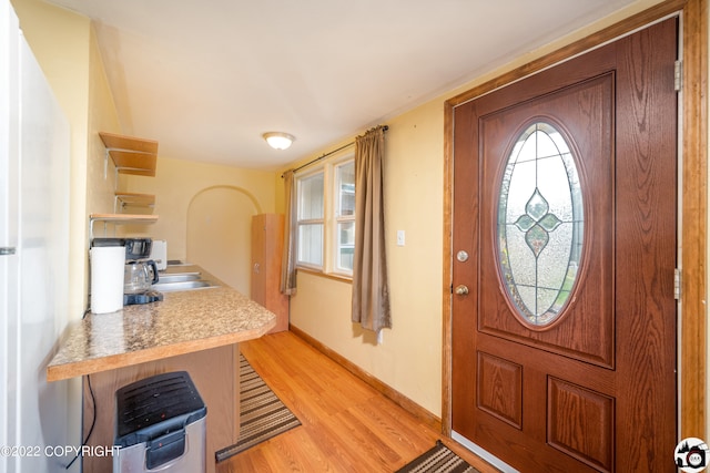 12230 Nautical Ave, Seward, AK 99664 - entrance foyer with light wood-style floors and baseboards
