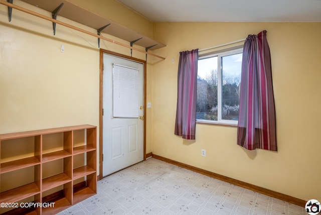 12230 Nautical Ave, Seward, AK 99664 - mudroom featuring tile patterned floors and lofted ceiling