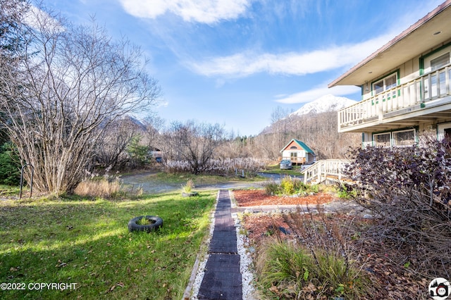 12230 Nautical Ave, Seward, AK 99664 - view of green lawn with a mountain view and a balcony