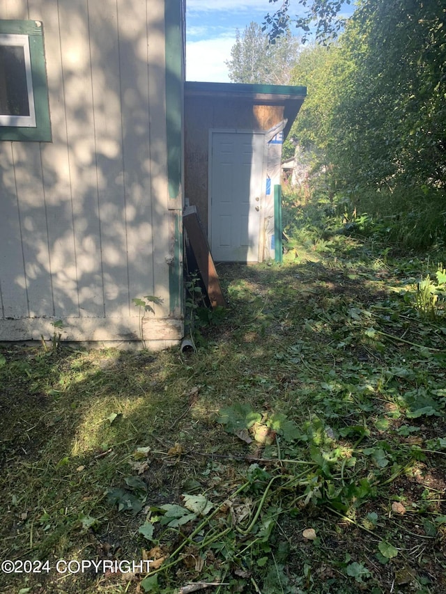 12230 Nautical Ave, Seward, AK 99664 - view of home's exterior featuring a storage unit
