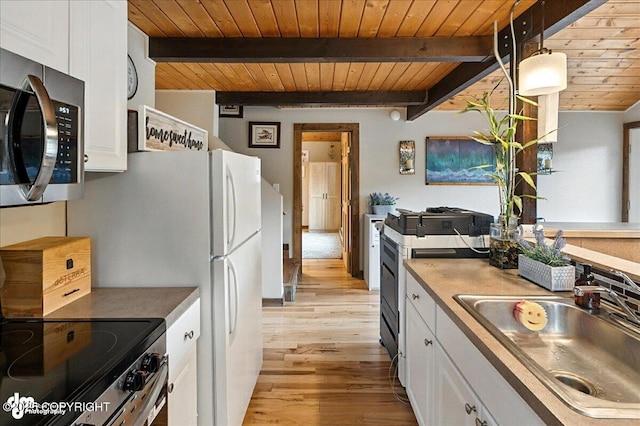 5968 Kenai Spur Highway, Kenai, AK 99611 - kitchen featuring appliances with stainless steel finishes, a wood ceiling with exposed beams, white cabinets, light wood-style floors, and decorative light fixtures