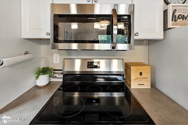 5968 Kenai Spur Highway, Kenai, AK 99611 - kitchen view of appliances with stainless steel finishes and white cabinets