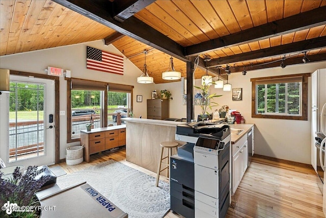 5968 Kenai Spur Highway, Kenai, AK 99611 - kitchen with wooden ceiling, light wood finished floors, light countertops, hanging light fixtures, and a peninsula