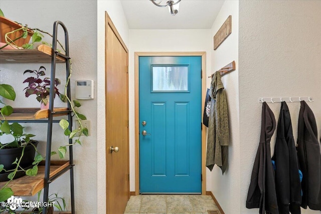 3800 E Birch View Dr, Wasilla, AK 99654 - entrance foyer with a textured wall and baseboards