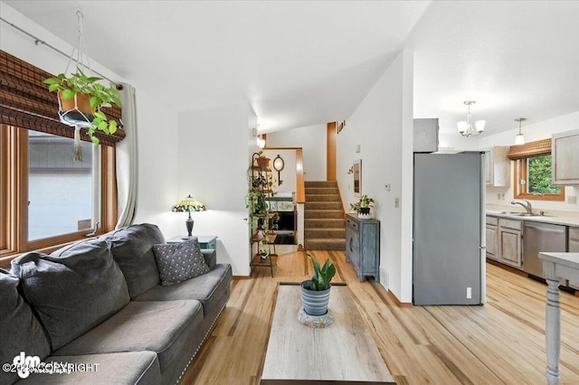 3800 E Birch View Dr, Wasilla, AK 99654 - living area featuring light wood-type flooring, a chandelier, and stairs