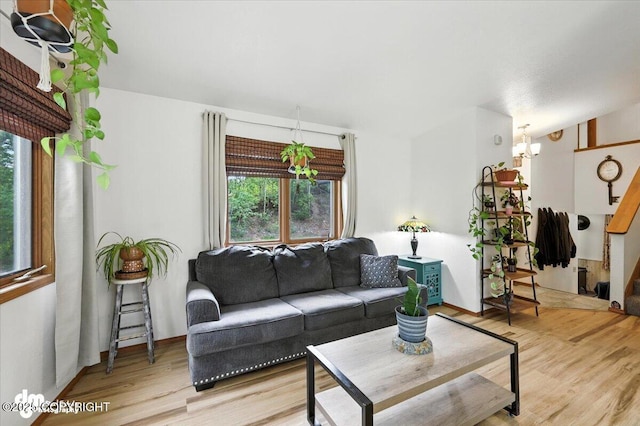 3800 E Birch View Dr, Wasilla, AK 99654 - living room with healthy amount of natural light, light wood-style floors, and a chandelier