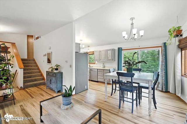 3800 E Birch View Dr, Wasilla, AK 99654 - dining room featuring a chandelier, light wood-style flooring, and stairway