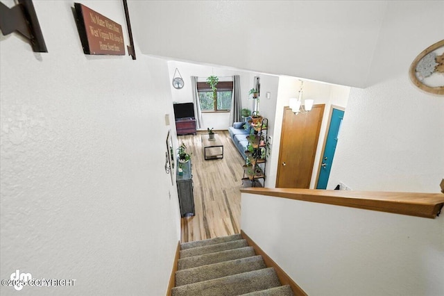 3800 E Birch View Dr, Wasilla, AK 99654 - stairs featuring a chandelier and wood finished floors