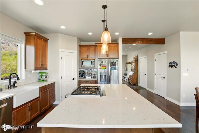 10380 Honey Bear Ln, Anchorage, AK 99516 - kitchen featuring stainless steel appliances, recessed lighting, a kitchen island, backsplash, and dark wood-style flooring
