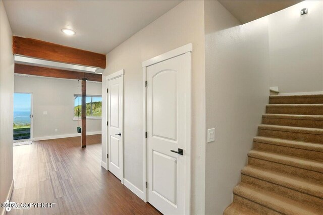 10380 Honey Bear Ln, Anchorage, AK 99516 - hallway featuring dark wood-style floors, stairs, recessed lighting, and beam ceiling