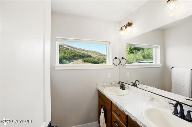 10380 Honey Bear Ln, Anchorage, AK 99516 - bathroom featuring double vanity and baseboards