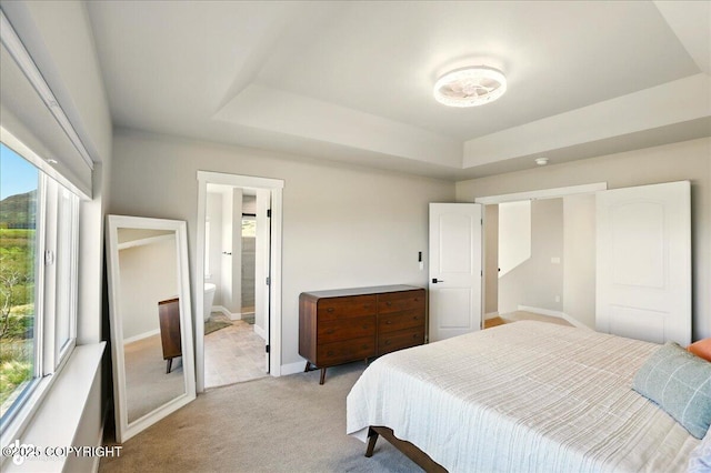 10380 Honey Bear Ln, Anchorage, AK 99516 - bedroom featuring a raised ceiling, light colored carpet, and ensuite bath