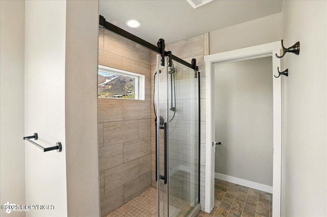 10380 Honey Bear Ln, Anchorage, AK 99516 - bathroom featuring a stall shower and baseboards