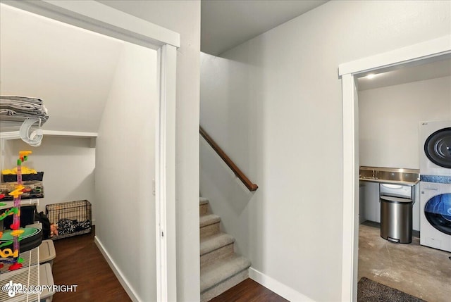 10380 Honey Bear Ln, Anchorage, AK 99516 - stairs with stacked washer and clothes dryer and baseboards