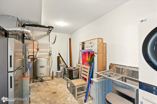 10380 Honey Bear Ln, Anchorage, AK 99516 - utilities with stacked washer / drying machine and water heater