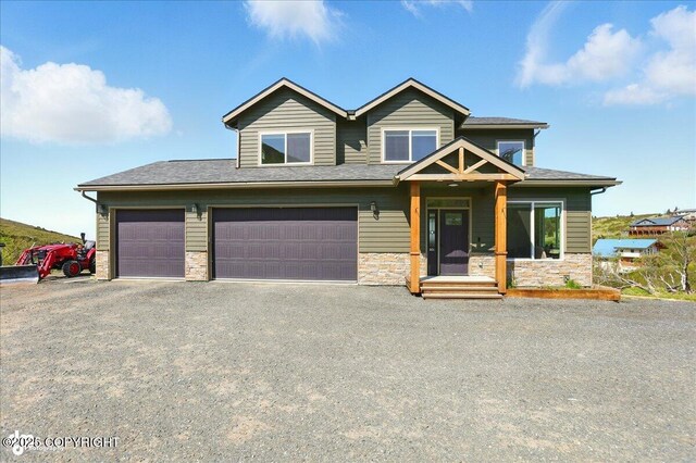 10380 Honey Bear Ln, Anchorage, AK 99516 - view of front facade with stone siding, asphalt driveway, and an attached garage