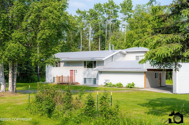1160 E Susitna Dr, Wasilla, AK 99654 - view of front of property featuring a front lawn, a metal roof, and an attached carport