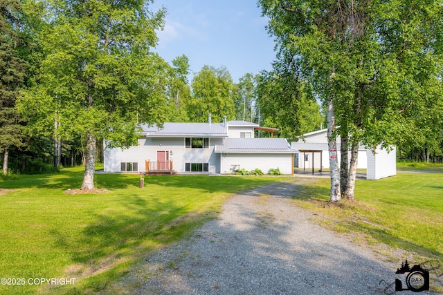 1160 E Susitna Dr, Wasilla, AK 99654 - view of front of house featuring gravel driveway, a front lawn, and a metal roof