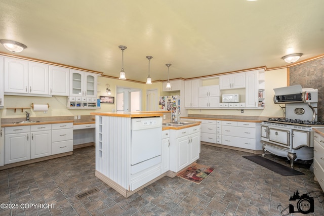 1160 E Susitna Dr, Wasilla, AK 99654 - kitchen featuring white appliances, wooden counters, open shelves, white cabinetry, and ornamental molding