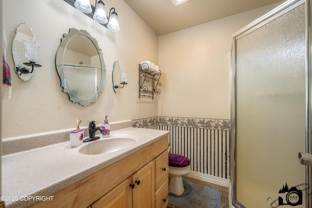 1160 E Susitna Dr, Wasilla, AK 99654 - bathroom featuring a stall shower, vanity, tile patterned flooring, and a wainscoted wall