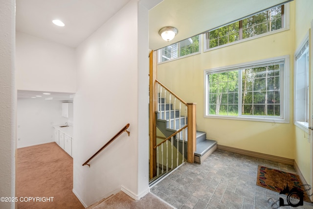 1160 E Susitna Dr, Wasilla, AK 99654 - staircase featuring baseboards and recessed lighting