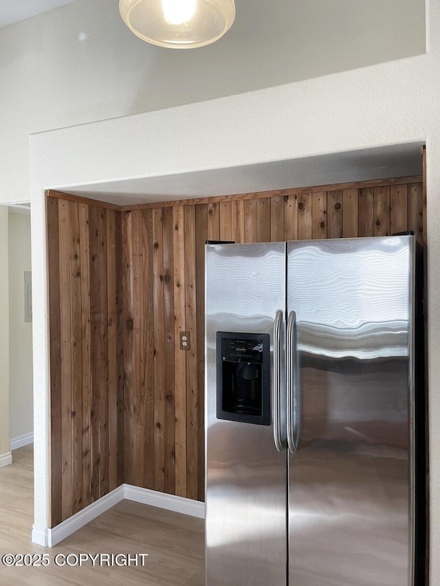 4310 Ambler Cir, Anchorage, AK 99504 - kitchen view of stainless steel fridge with ice dispenser, light wood-style floors, and brown cabinets