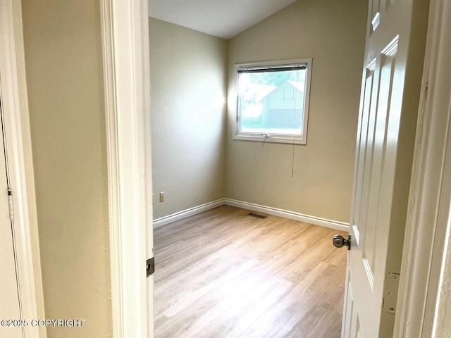 4310 Ambler Cir, Anchorage, AK 99504 - spare room featuring wood finished floors and vaulted ceiling