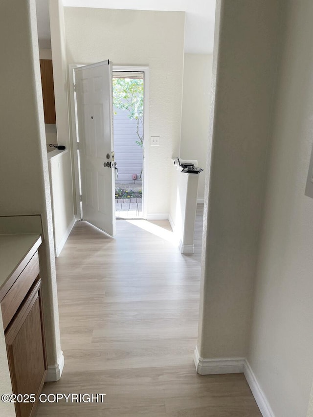 4310 Ambler Cir, Anchorage, AK 99504 - hallway featuring light wood-style flooring and baseboards