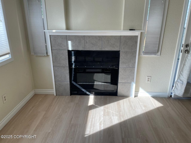 4310 Ambler Cir, Anchorage, AK 99504 - detailed view of wood finished floors and a tile fireplace