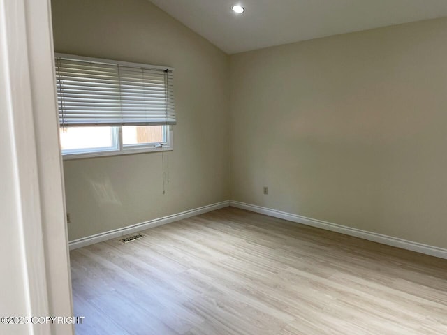 4310 Ambler Cir, Anchorage, AK 99504 - spare room featuring vaulted ceiling, wood finished floors, and recessed lighting