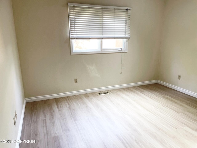 4310 Ambler Cir, Anchorage, AK 99504 - spare room featuring wood finished floors and baseboards