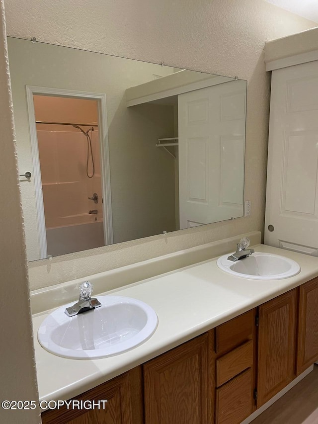 4310 Ambler Cir, Anchorage, AK 99504 - bathroom featuring double vanity and shower / tub combination