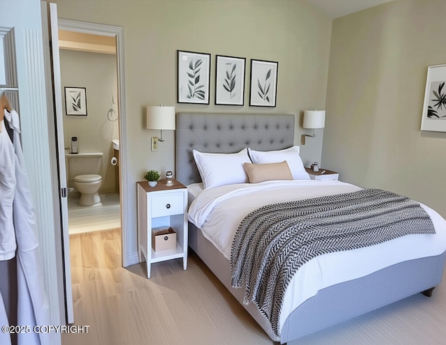 4310 Ambler Cir, Anchorage, AK 99504 - bedroom with ensuite bathroom and wood finished floors