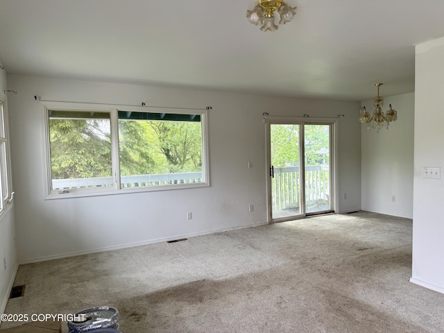 1140 Lalande Pl, Anchorage, AK 99504 - carpeted spare room featuring a chandelier and baseboards