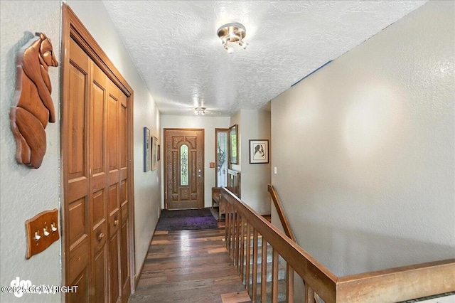 19360 Chugach Park Dr, Chugiak, AK 99567 - entryway with a textured ceiling and dark wood-type flooring