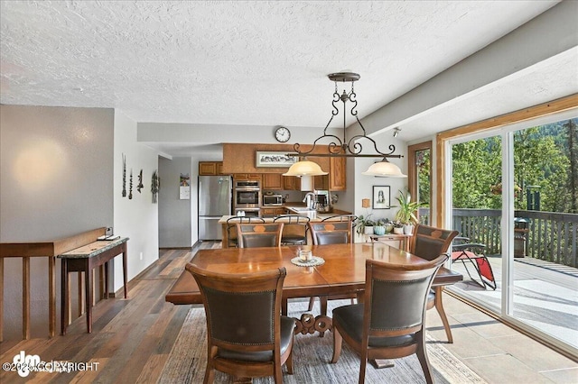 19360 Chugach Park Dr, Chugiak, AK 99567 - dining space with a textured ceiling and light wood finished floors