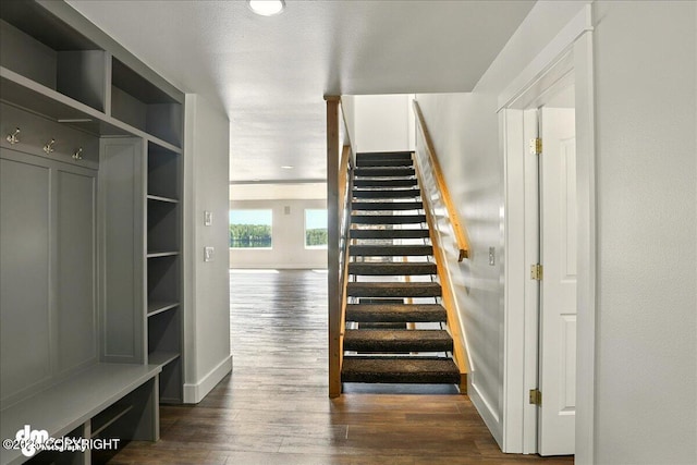 5100 W Lakeside Dr, Wasilla, AK 99654 - stairs with baseboards and wood finished floors