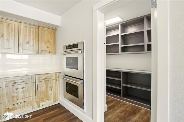 5100 W Lakeside Dr, Wasilla, AK 99654 - kitchen with stainless steel double oven, light brown cabinets, dark wood-type flooring, and decorative backsplash
