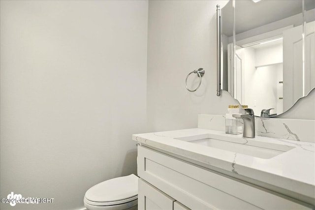 5100 W Lakeside Dr, Wasilla, AK 99654 - bathroom featuring vanity and toilet