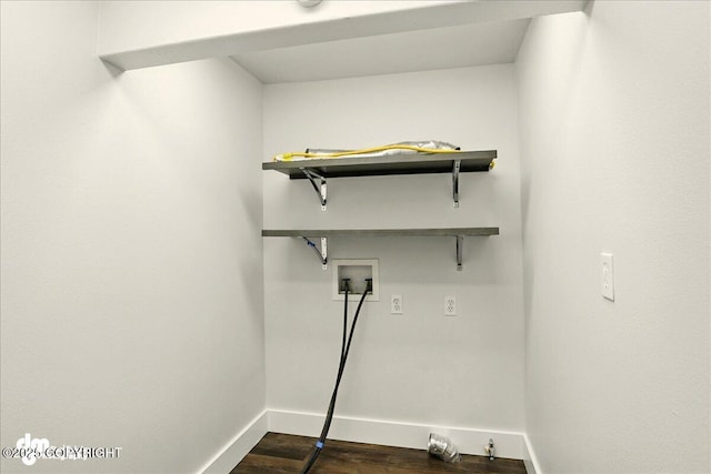 5100 W Lakeside Dr, Wasilla, AK 99654 - laundry room with hookup for a washing machine and dark wood-type flooring
