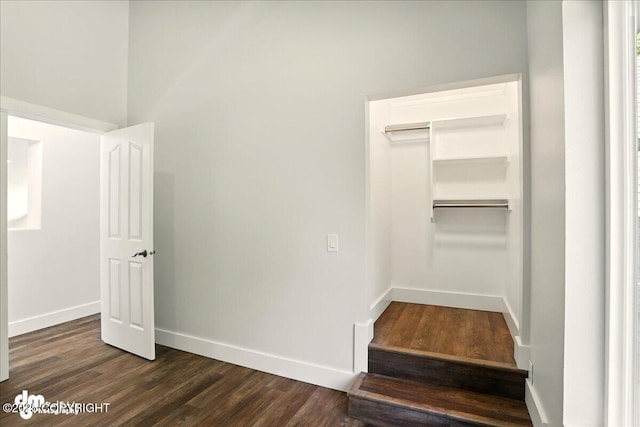 5100 W Lakeside Dr, Wasilla, AK 99654 - unfurnished bedroom featuring dark wood-type flooring and a closet