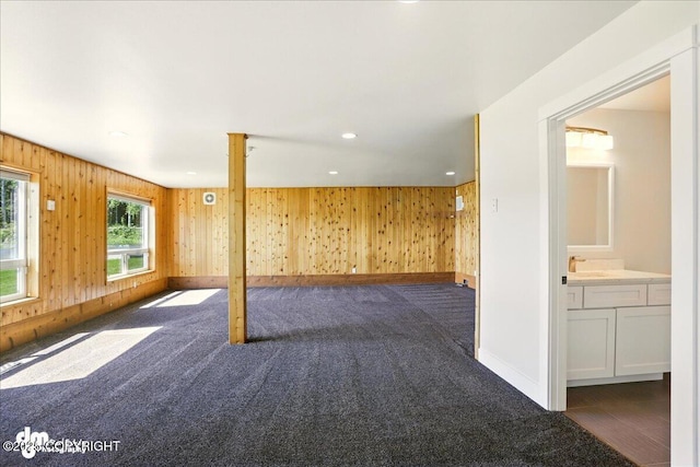 5100 W Lakeside Dr, Wasilla, AK 99654 - spare room featuring wooden walls, dark carpet, and recessed lighting