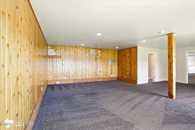 5100 W Lakeside Dr, Wasilla, AK 99654 - carpeted empty room featuring wood walls and recessed lighting