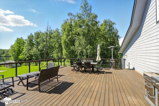 5100 W Lakeside Dr, Wasilla, AK 99654 - wooden terrace featuring outdoor dining space and a yard