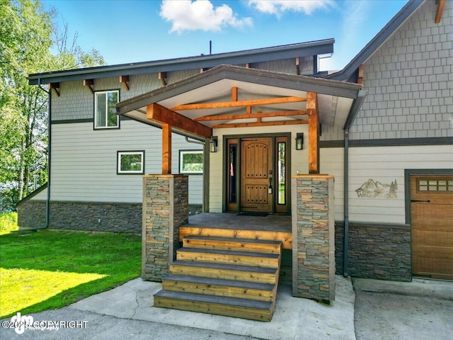 5100 W Lakeside Dr, Wasilla, AK 99654 - property entrance featuring stone siding and a yard